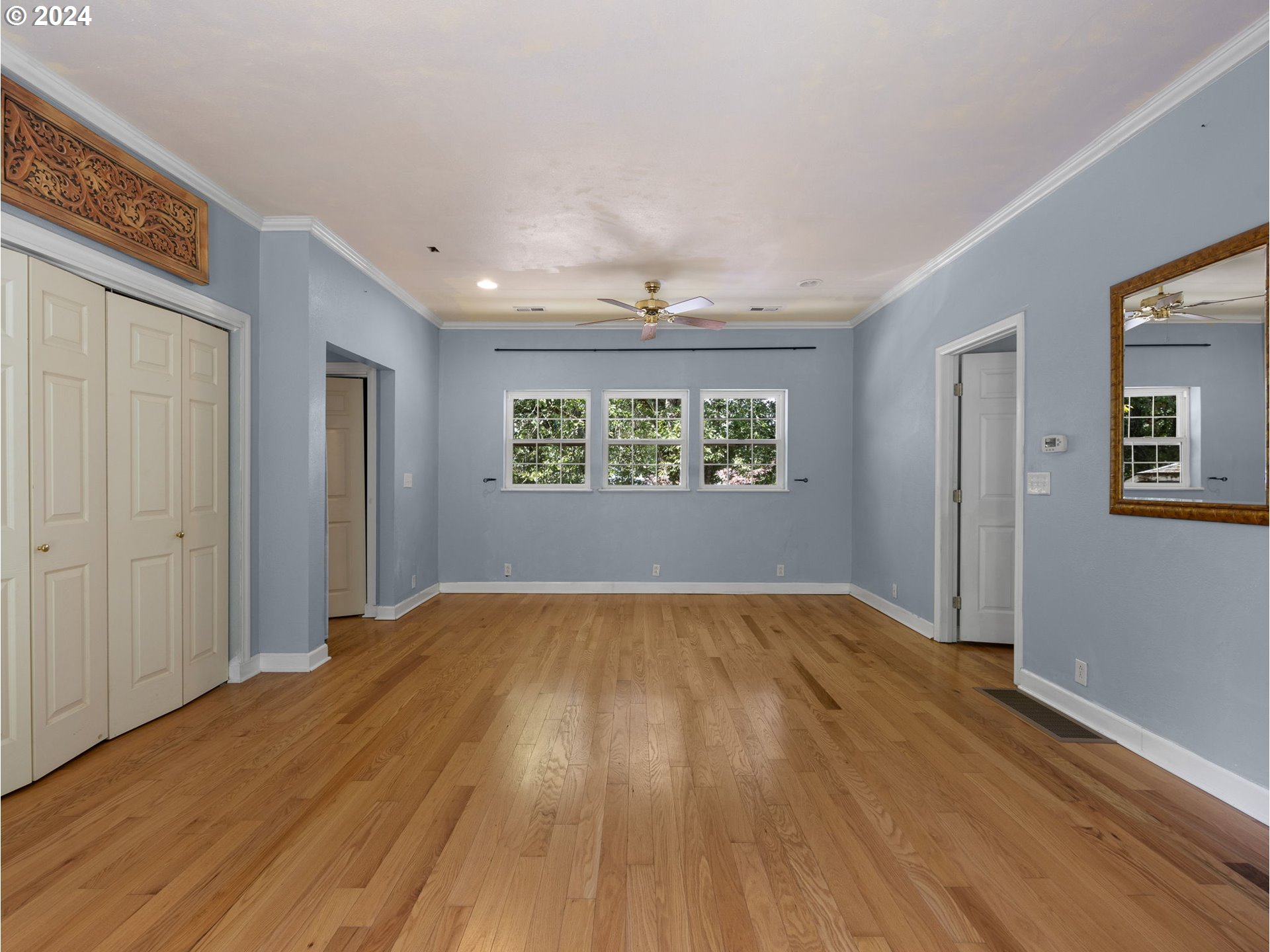 38631 Southeast Hudson Road Boring, OR 97009 - Photo 13 of 39 a view of an empty room with wooden floor and a window