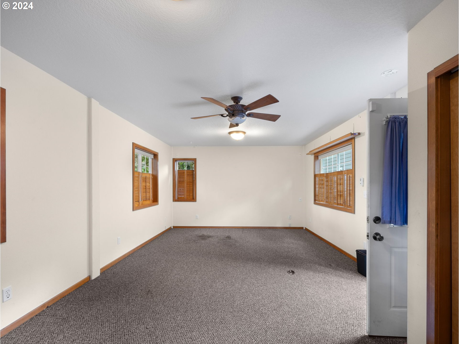38631 Southeast Hudson Road Boring, OR 97009 - Photo 30 of 39 a view of a livingroom with a ceiling fan and window