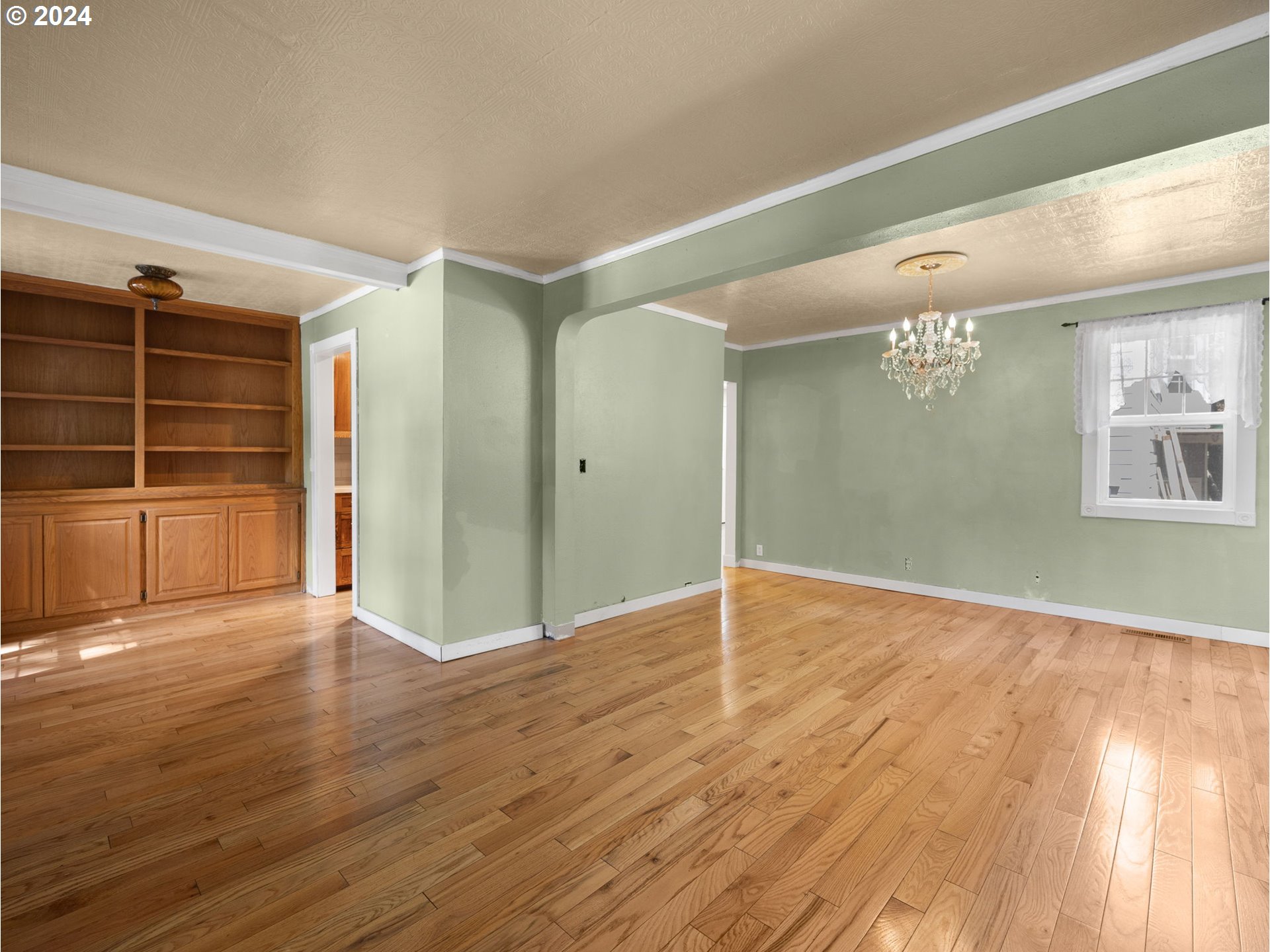 38631 Southeast Hudson Road Boring, OR 97009 - Photo 4 of 39 a view of an empty room with wooden floor