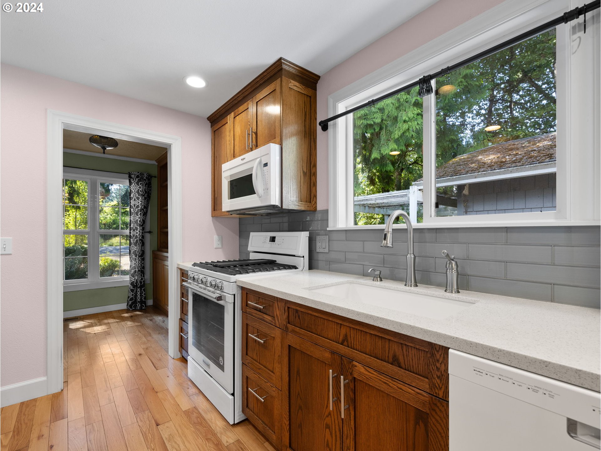 38631 Southeast Hudson Road Boring, OR 97009 - Photo 6 of 39 a kitchen with a sink wooden floor and a large window