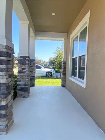 a view of open kitchen with a large window and a sink