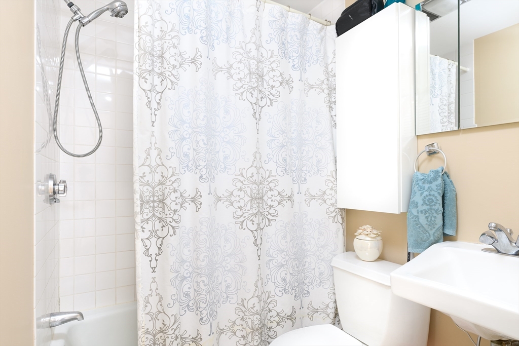 261 Marlborough Street, Unit 11 Boston, MA 02116 - Photo 12 of 17 a bathroom with a sink toilet and shower