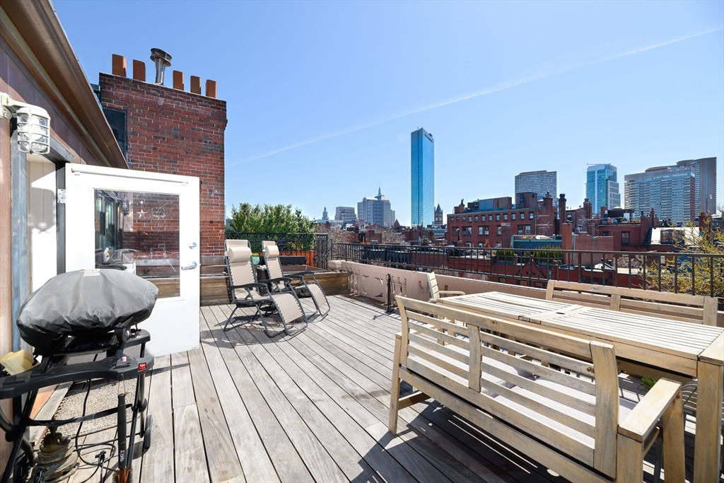 261 Marlborough Street, Unit 11 Boston, MA 02116 - Photo 7 of 17 a view of a terrace with seating area and furniture