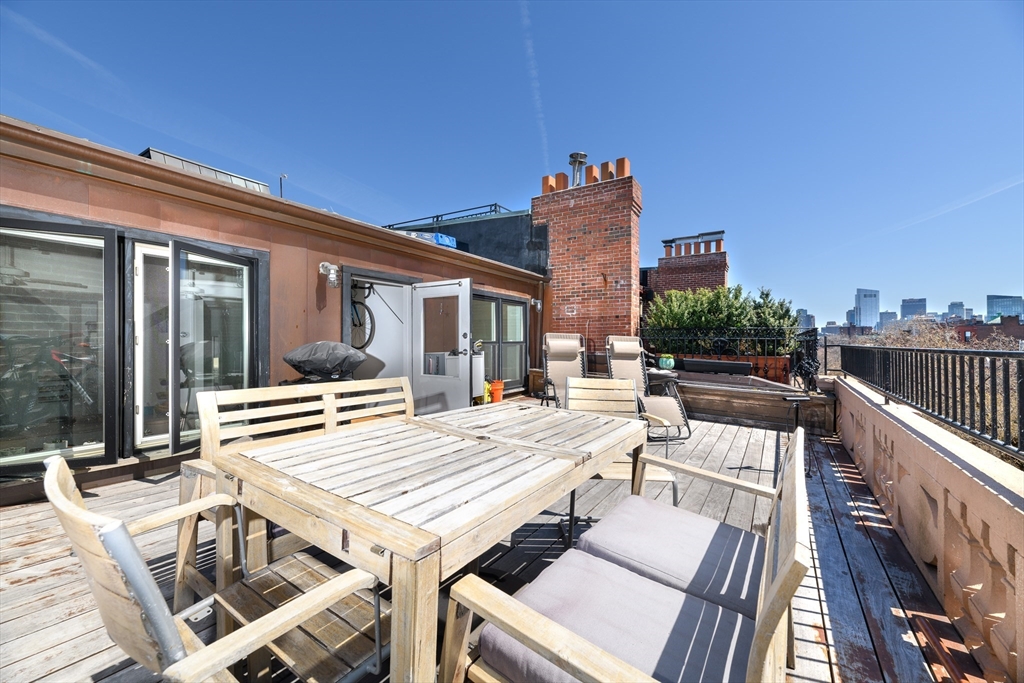 261 Marlborough Street, Unit 11 Boston, MA 02116 - Photo 8 of 17 a view of a patio with couches table and chairs