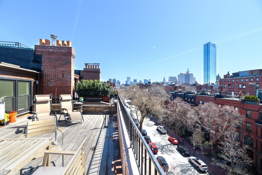 261 Marlborough Street, Unit 11 Boston, MA 02116 - Photo 9 of 17 a view of roof deck with patio