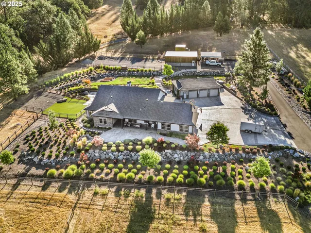 an aerial view of a house with a lake view