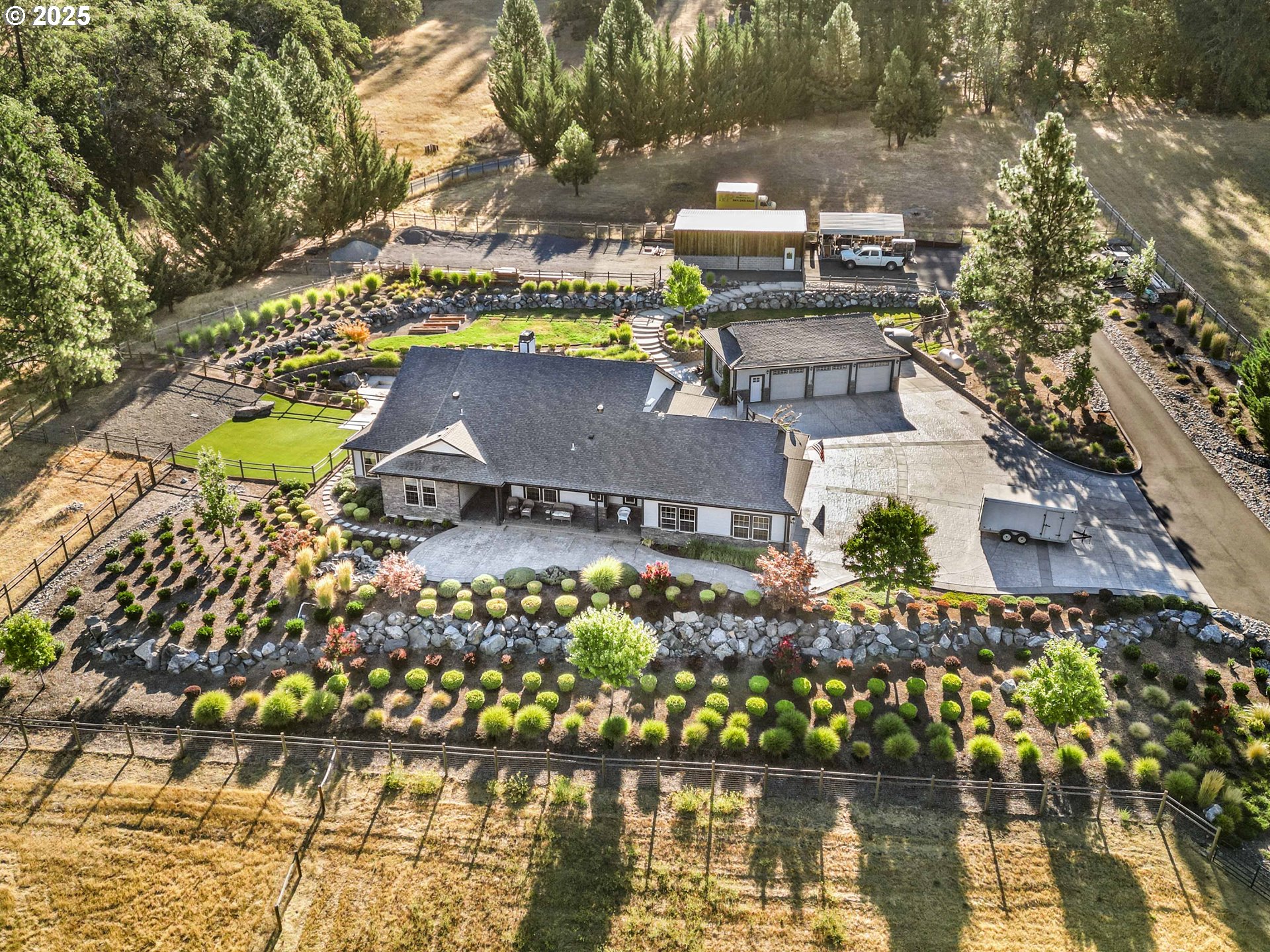 an aerial view of a house with a lake view