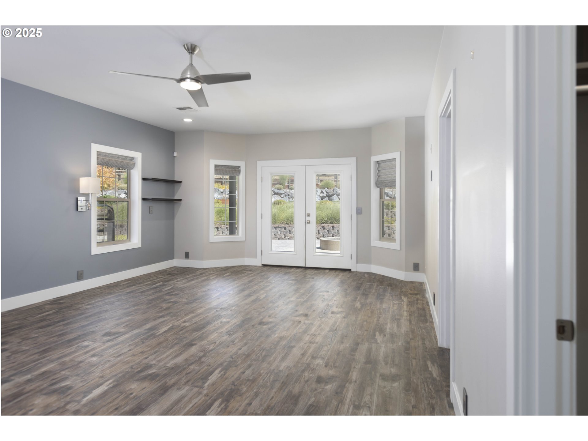 3465 Galls Creek Road Gold Hill, OR 97525 - Photo 11 of 30 a view of an empty room with a window and wooden floor