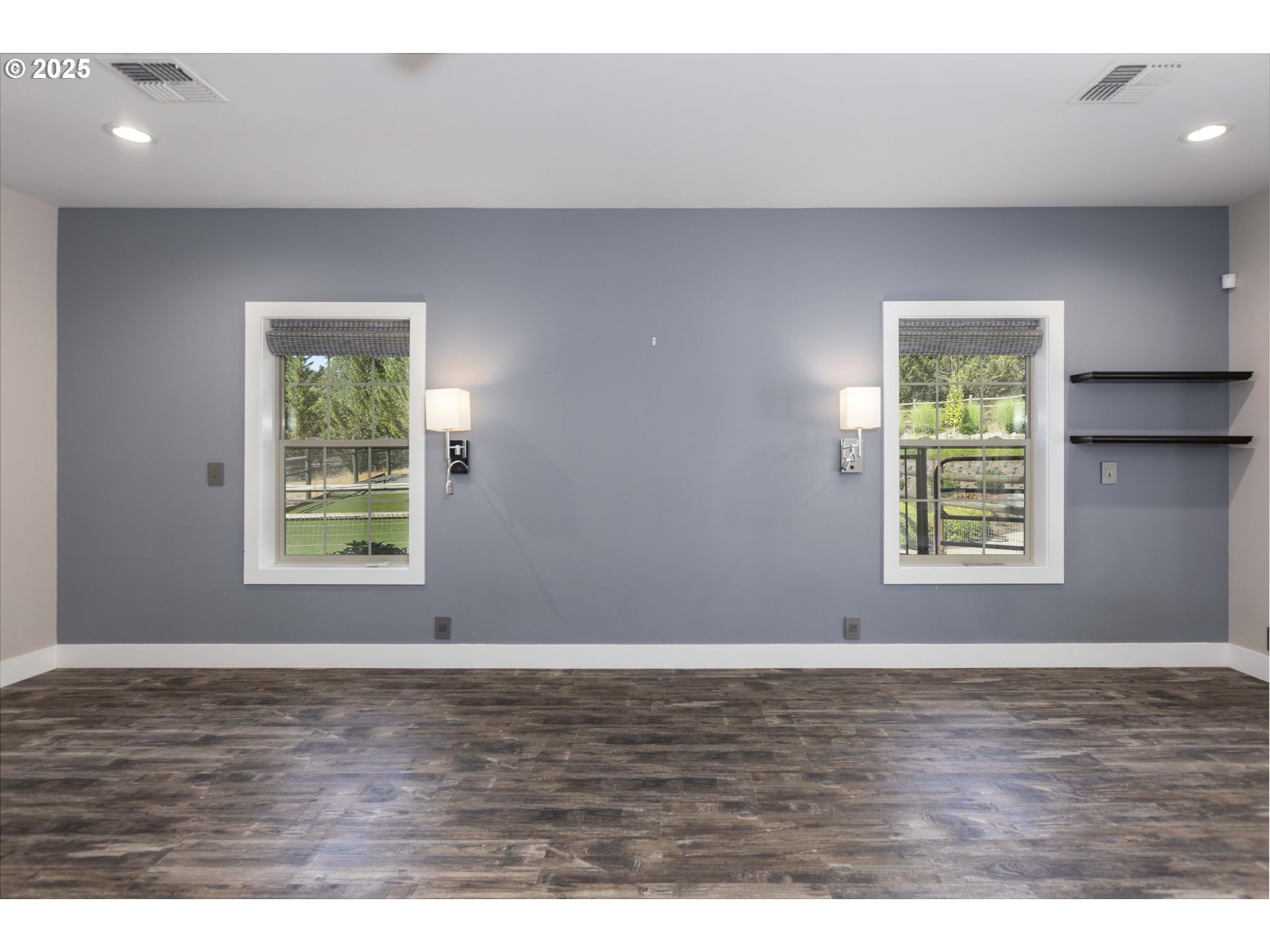 3465 Galls Creek Road Gold Hill, OR 97525 - Photo 12 of 30 an empty room with wooden floor and windows