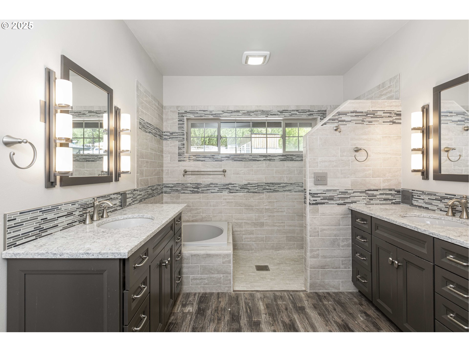 3465 Galls Creek Road Gold Hill, OR 97525 - Photo 13 of 30 a bathroom with a granite countertop sink a mirror and a shower