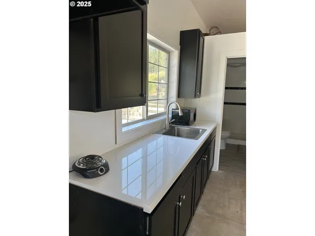 a kitchen with a sink and a window