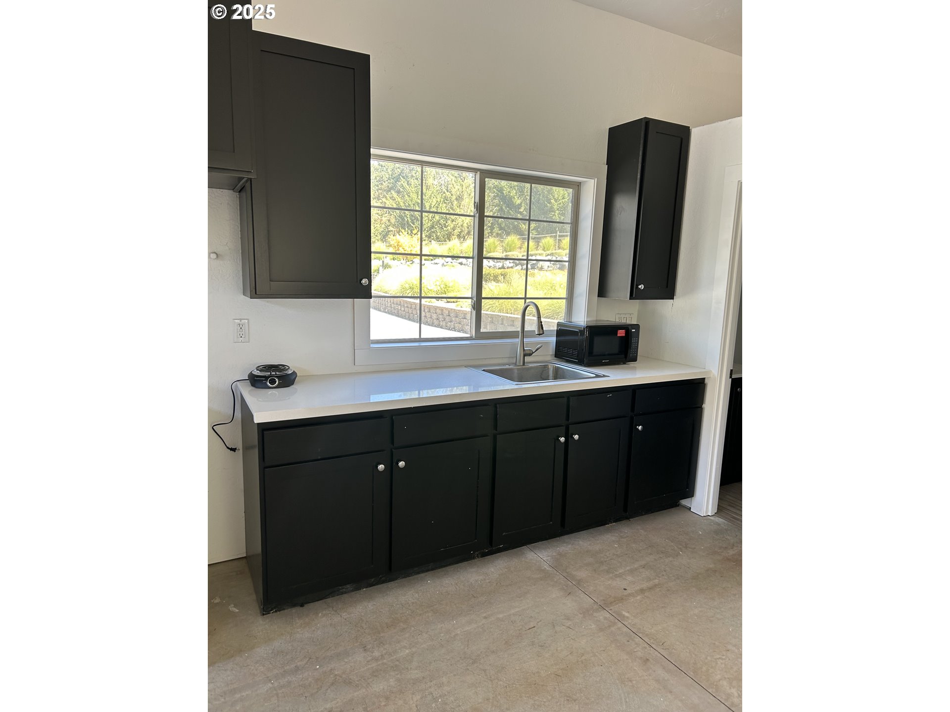 3465 Galls Creek Road Gold Hill, OR 97525 - Photo 25 of 30 a kitchen with a sink and a window