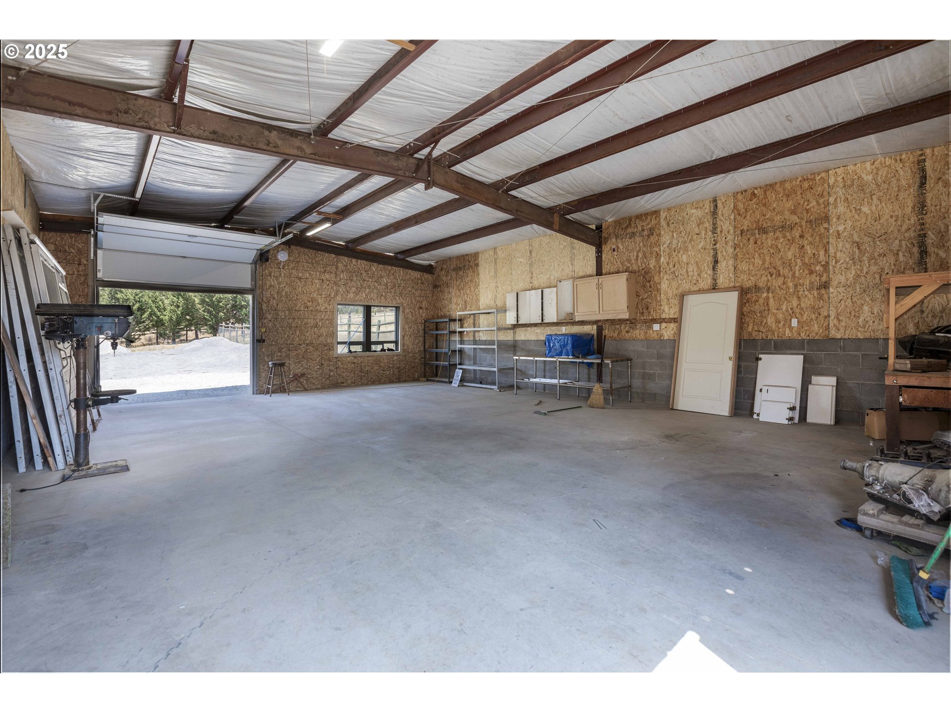 3465 Galls Creek Road Gold Hill, OR 97525 - Photo 28 of 30 a view of empty room with wooden floor and furniture