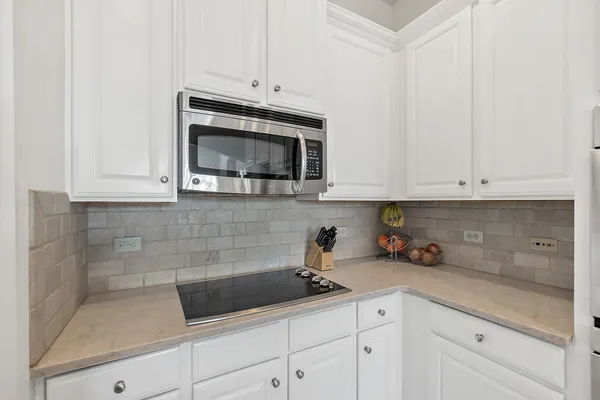a view of backyard with a table and chairs