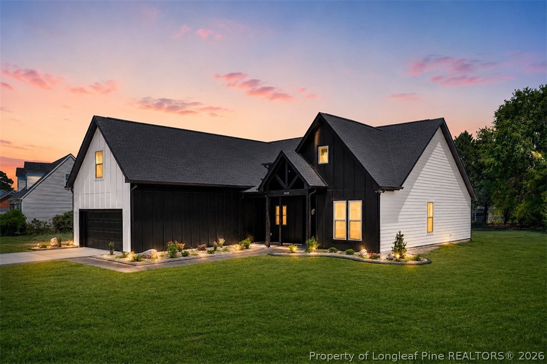 3025 Old Stage Road South Erwin, NC 28339 - Photo 2 of 50 a front view of house with a garden