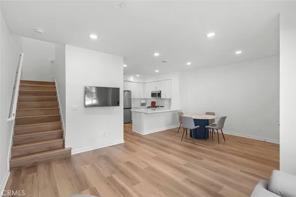 a view of kitchen dining table and chairs