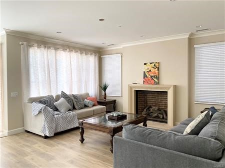 55 Umbria Irvine, CA 92618 - Photo 2 of 15 a living room with furniture and a fireplace
