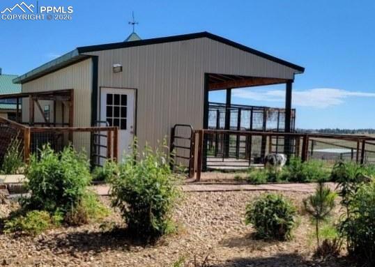 5910 McCart Ranch Circle Elizabeth, CO 80107 - Photo 31 of 50 a front view of a house with garden