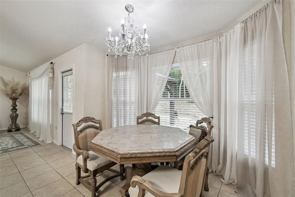 270 Planter Road Spring Hill, FL 34606 - Photo 14 of 33 a view of a dining room with furniture and window