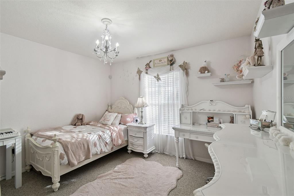 270 Planter Road Spring Hill, FL 34606 - Photo 19 of 33 a bedroom with a bed furniture and window