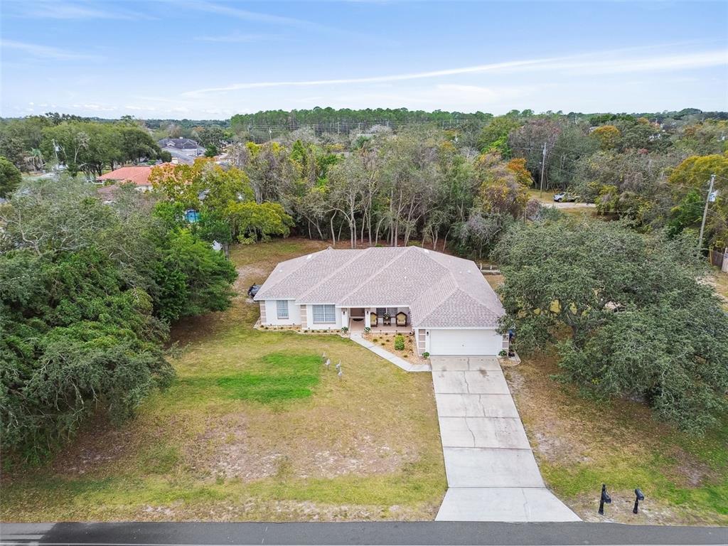 270 Planter Road Spring Hill, FL 34606 - Photo 28 of 33 a aerial view of a house with a yard