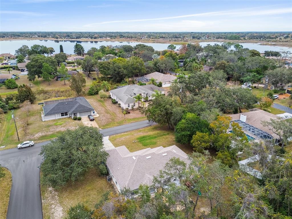 270 Planter Road Spring Hill, FL 34606 - Photo 32 of 33 an aerial view of a house with a yard