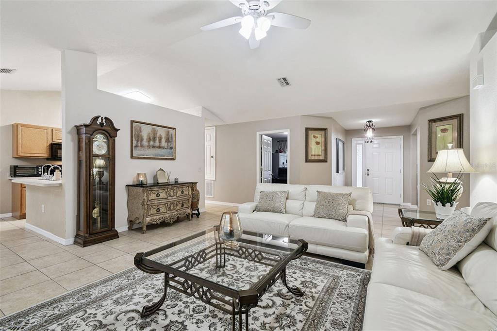 270 Planter Road Spring Hill, FL 34606 - Photo 6 of 33 a living room with furniture and a rug