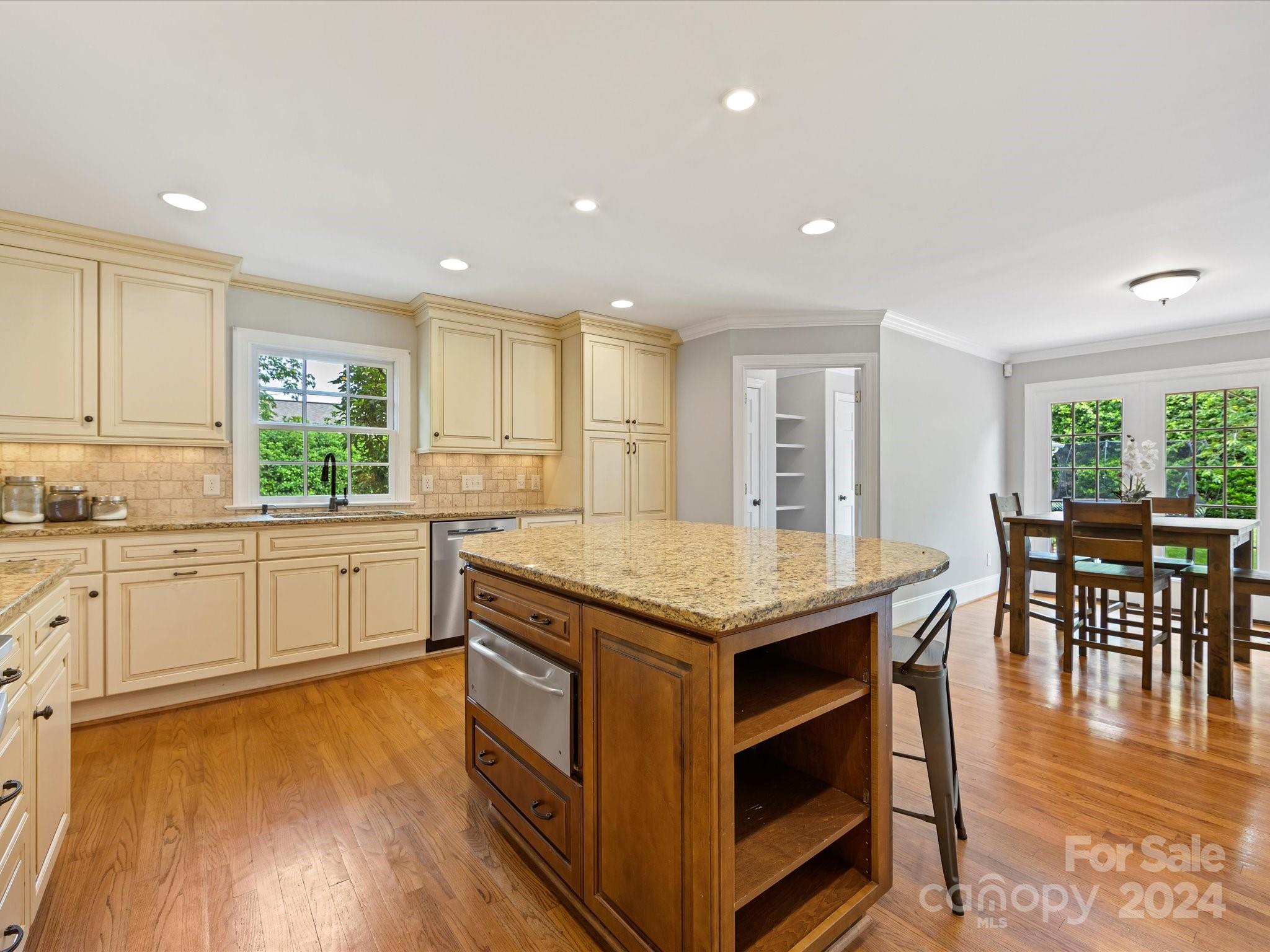 3200 Wickersham Road Charlotte, NC 28211 - Photo 12 of 35 a kitchen with a wooden floor and window