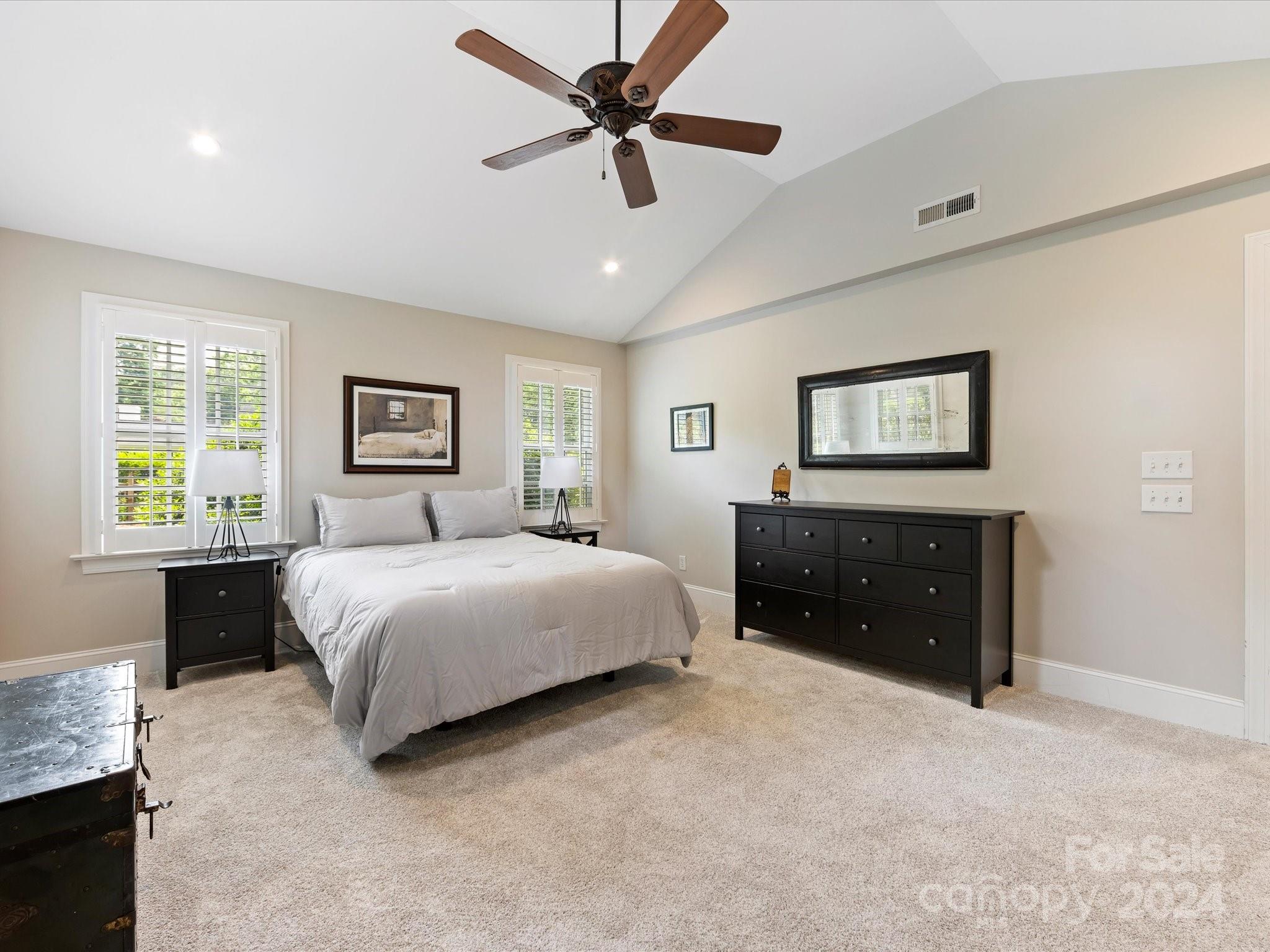 3200 Wickersham Road Charlotte, NC 28211 - Photo 16 of 35 a bedroom with a bed and a dresser