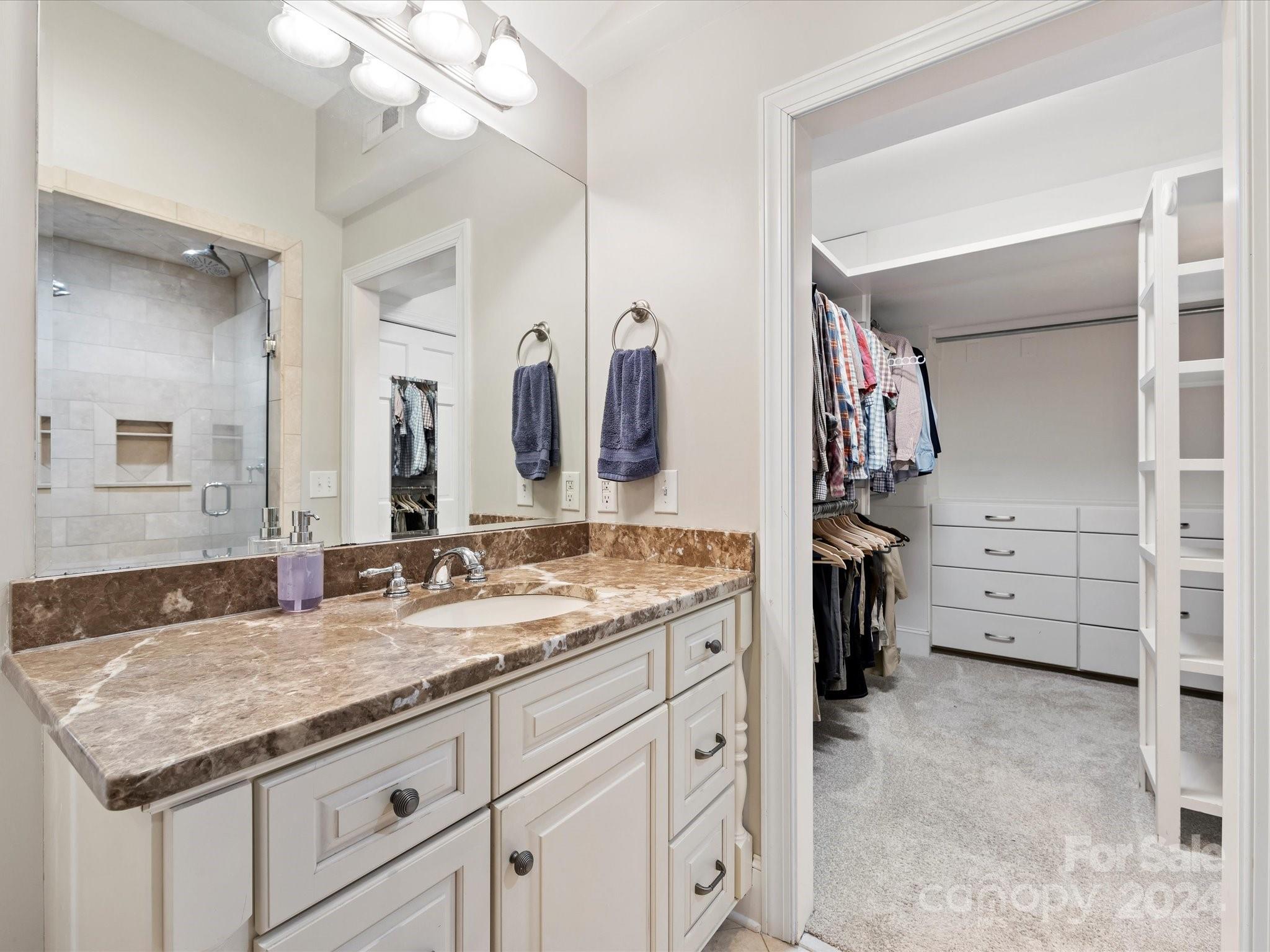 3200 Wickersham Road Charlotte, NC 28211 - Photo 19 of 35 a bathroom with a granite countertop sink mirror and