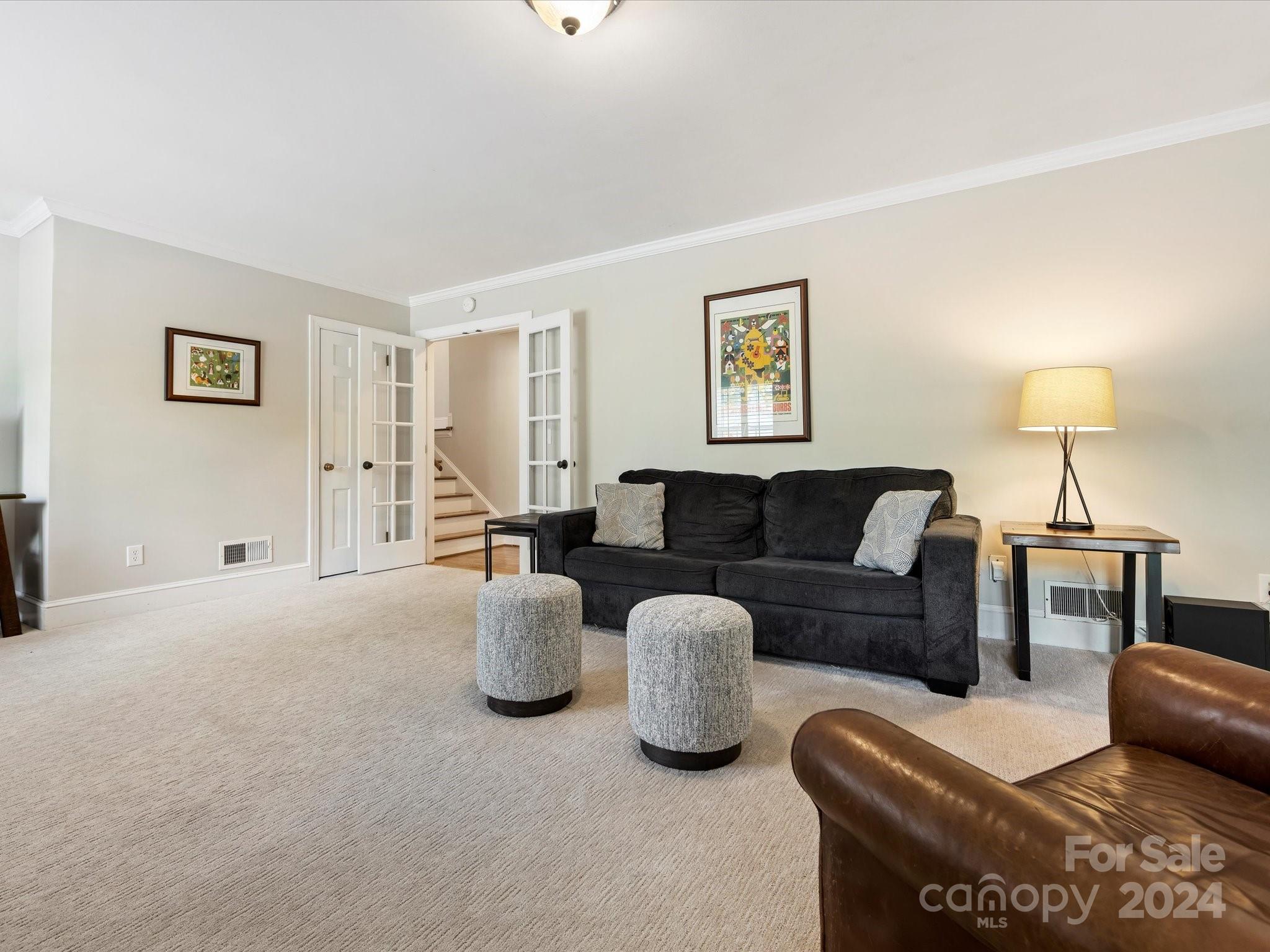 3200 Wickersham Road Charlotte, NC 28211 - Photo 23 of 35 a living room with furniture and a lamp