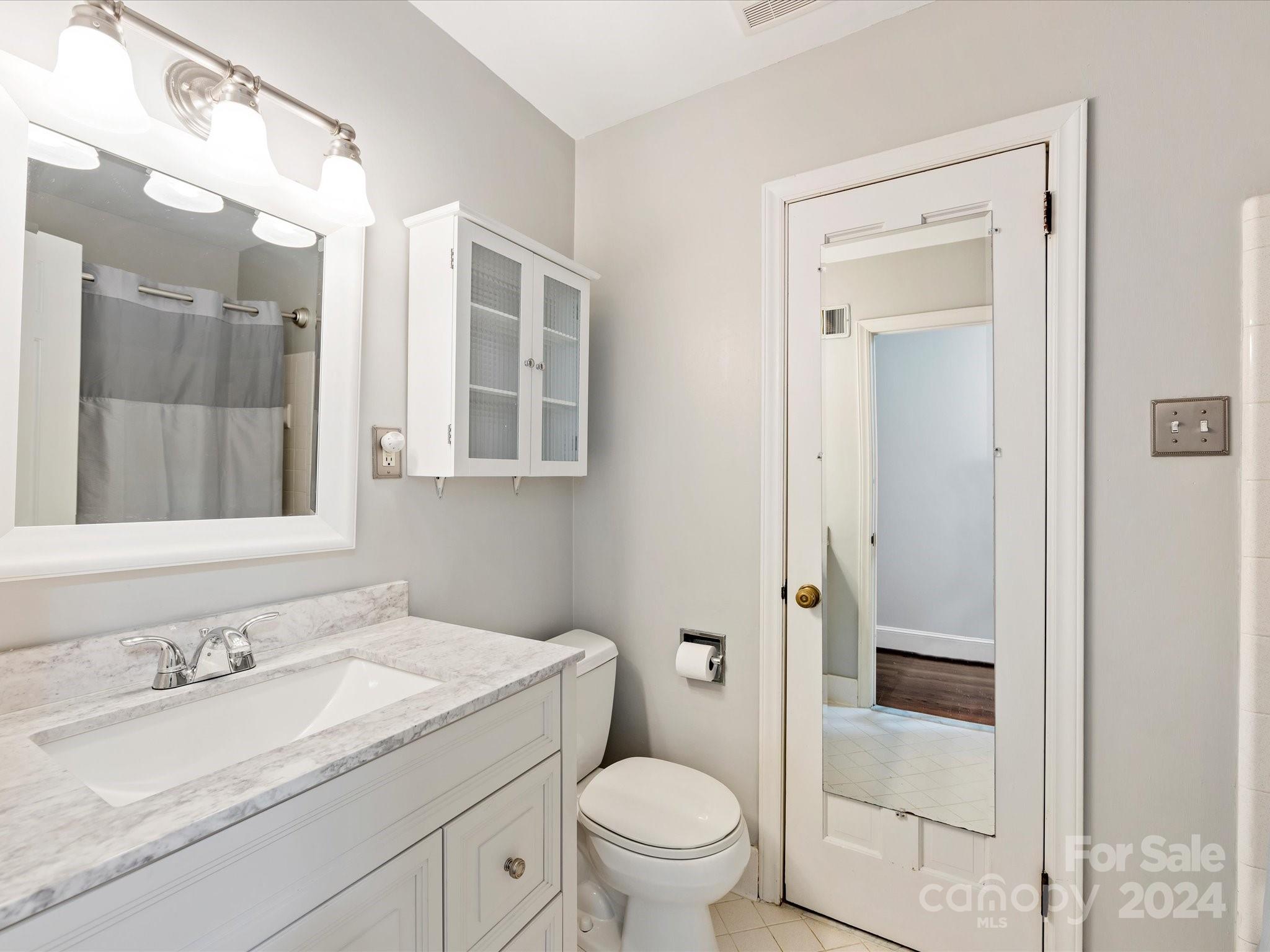 3200 Wickersham Road Charlotte, NC 28211 - Photo 25 of 35 a bathroom with a granite countertop sink toilet and shower