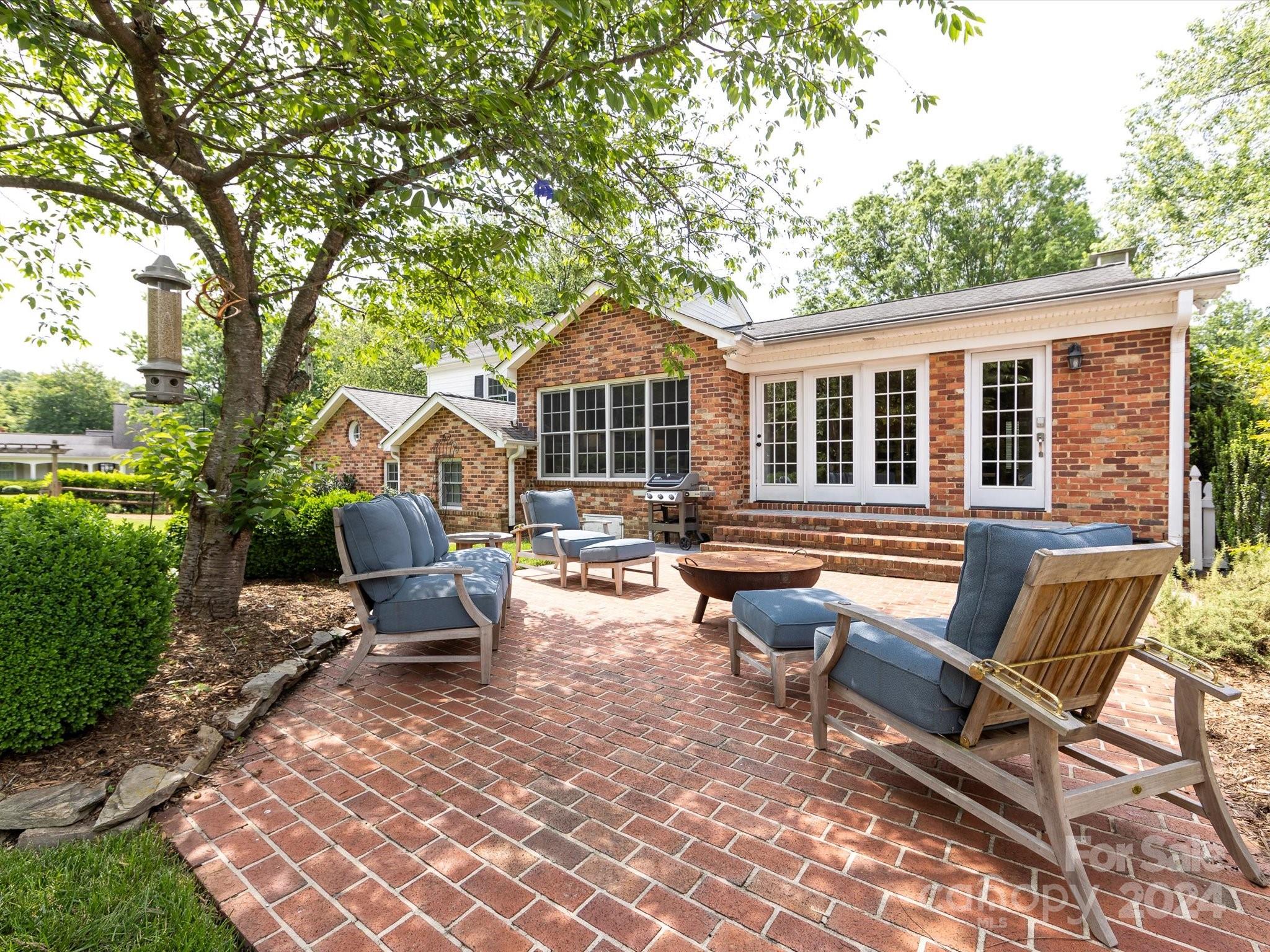 3200 Wickersham Road Charlotte, NC 28211 - Photo 31 of 35 a view of a house with backyard sitting area and garden