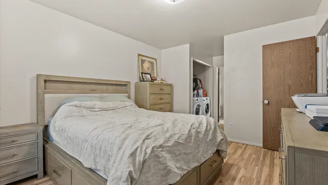 a bedroom with a bed and a dresser