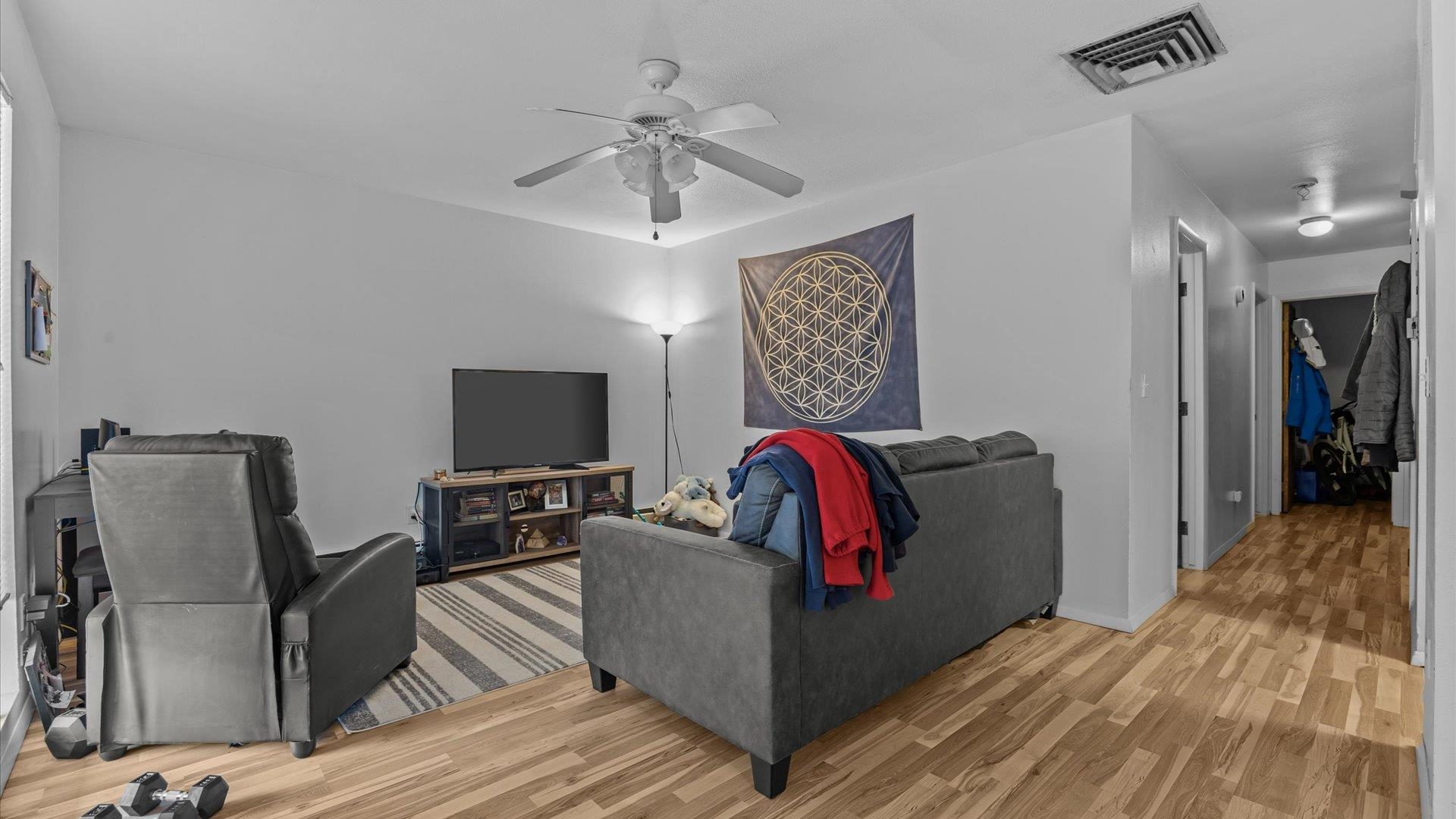 804 West Cedar Court Fruita, CO 81521 - Photo 21 of 40 a living room with furniture and a flat screen tv