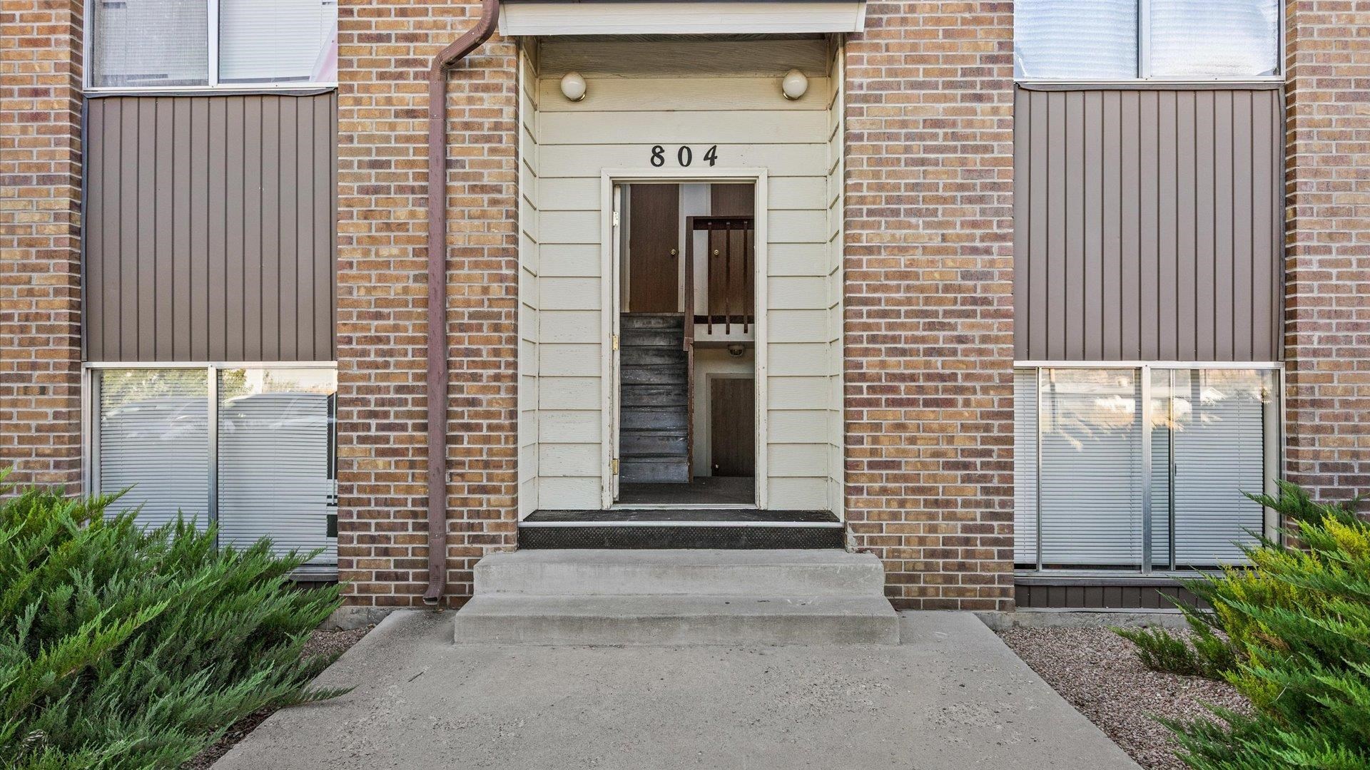 804 West Cedar Court Fruita, CO 81521 - Photo 5 of 40 a front view of a house with a door