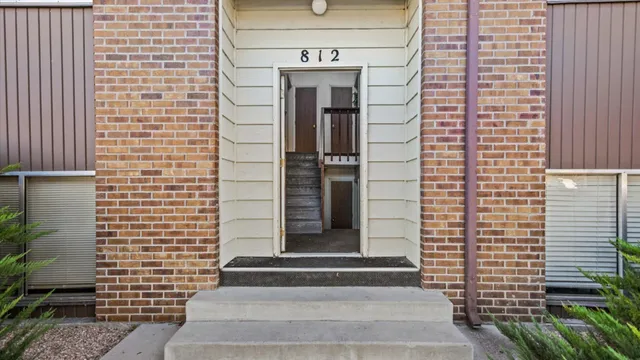 a front view of a house with stairs