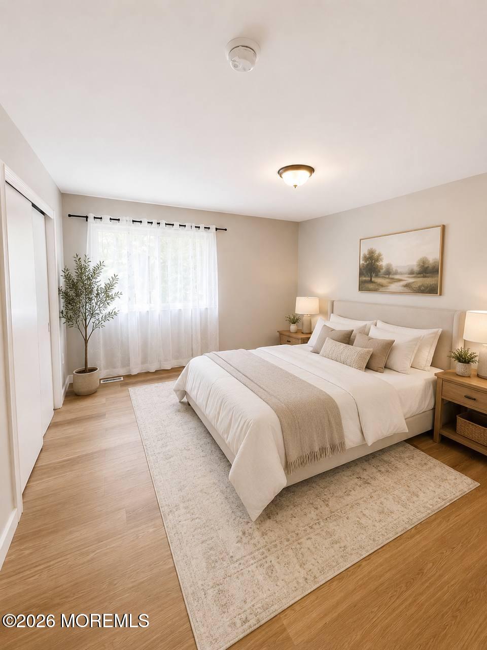1144 Sawmill Road, Unit 121 Brick, NJ 08724 - Photo 15 of 23 a bedroom with a large bed and a large window