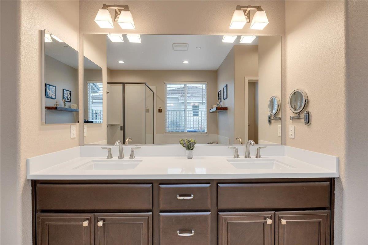 133 Palisades Place Copperopolis, CA 95228 - Photo 63 of 95 a bathroom with a sink double vanity and a mirror