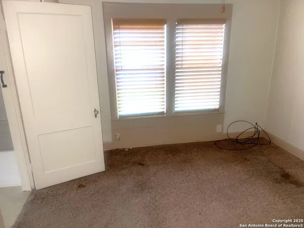 a view of a room that has a window in it