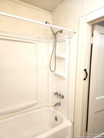 a bathroom with a bath tub