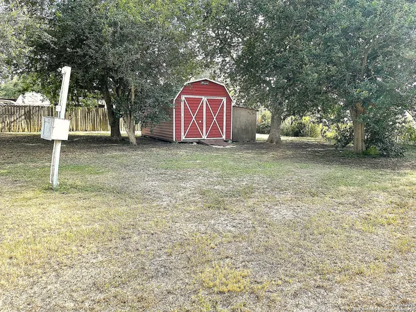 a view of a back yard of the house