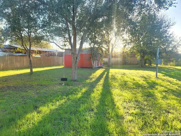 a view of back yard with green space