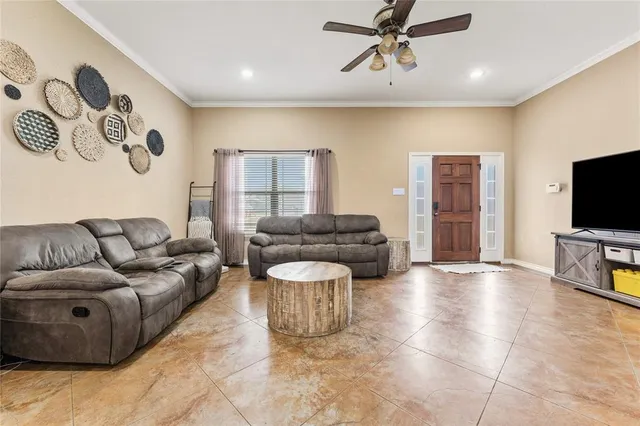 a view of a kitchen with a refrigerator and a sink