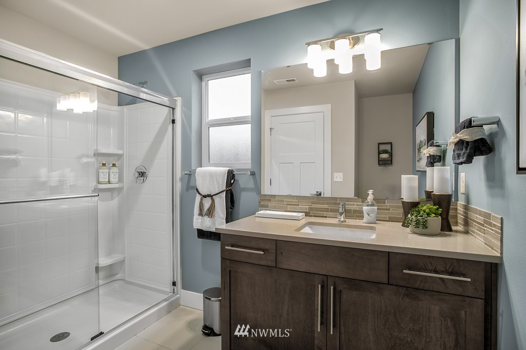 19925 Jewell Road, Unit 15 Bothell, WA 98012 - Photo 13 of 27 a bathroom with a sink mirror and shower