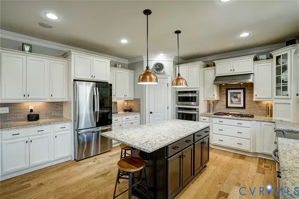 a kitchen with a refrigerator a sink and dishwasher