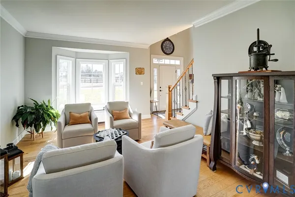 a bedroom with a bed and a flat tv screen on dresser
