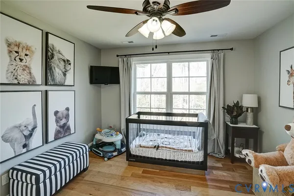a living room with furniture a piano and a flat screen tv