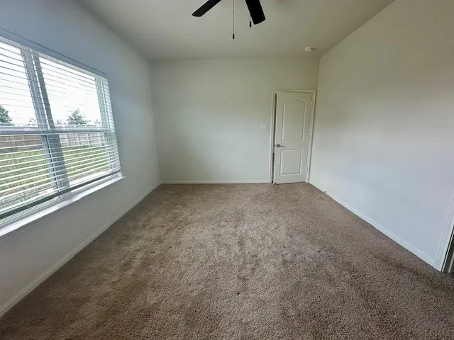 an empty room with a empty space and a window