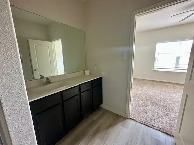 a bathroom with a double vanity sink and mirror